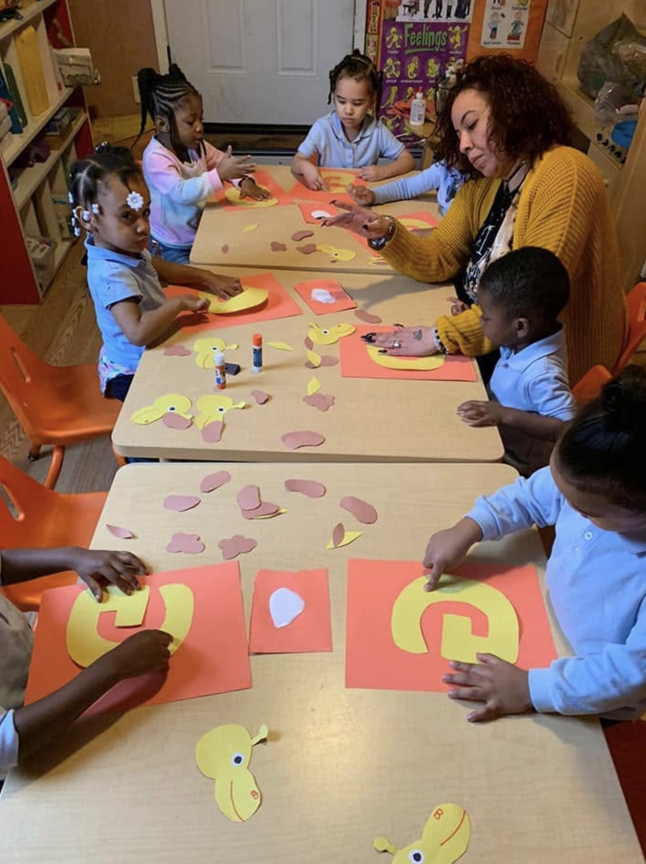 Children creating colorful art projects with their teacher